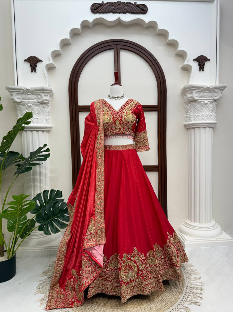 Regal Crimson Red Bridal Lehenga Choli Ensemble Featuring Intricate Gold Zari Embroidery, Heritage Motifs, and Embellished Tassels